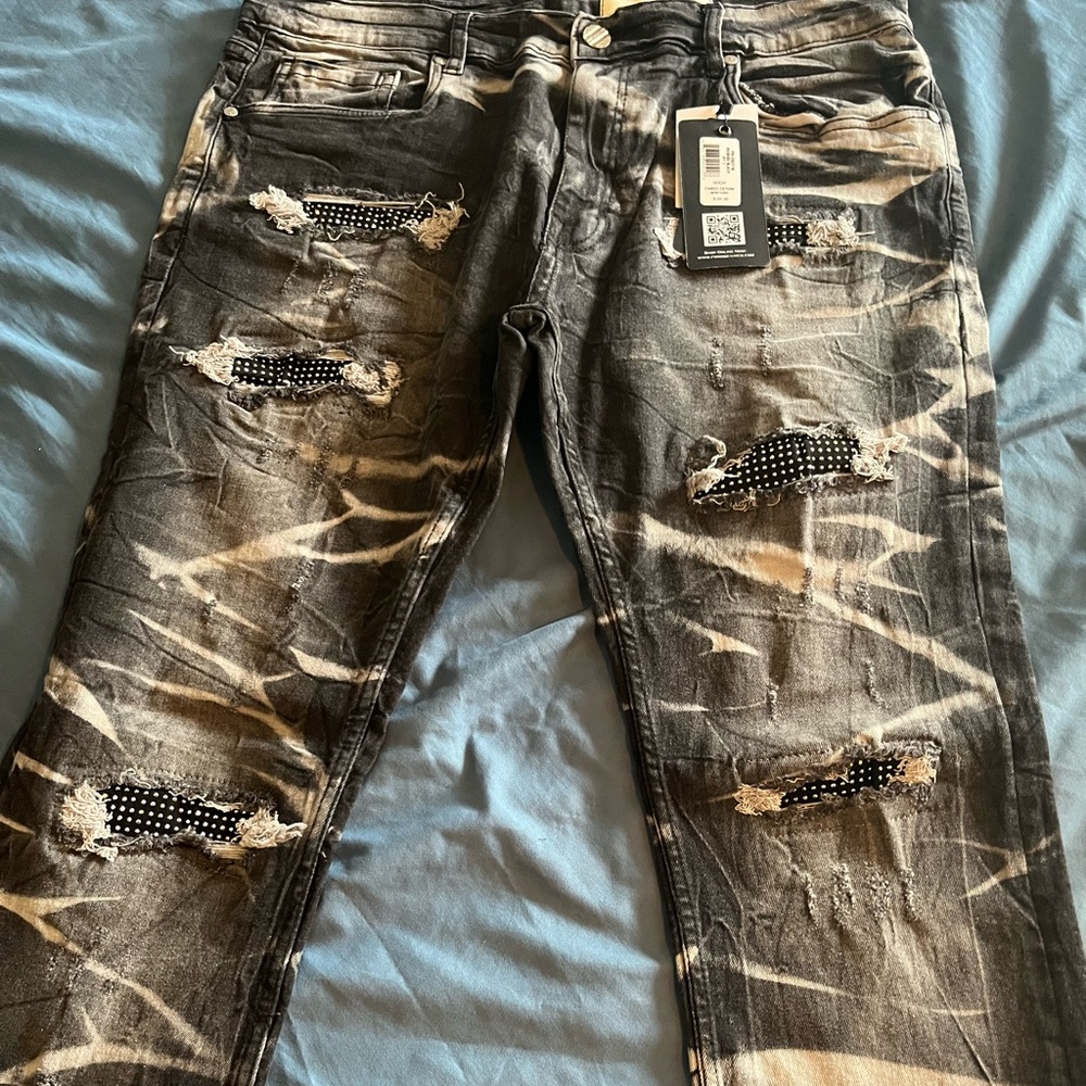 Men's Distressed Black Tie-Dye Jeans with Patch Details